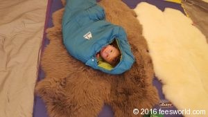 Thing 1 inside a sleeping bag testing out the comfort of the floor with insulation