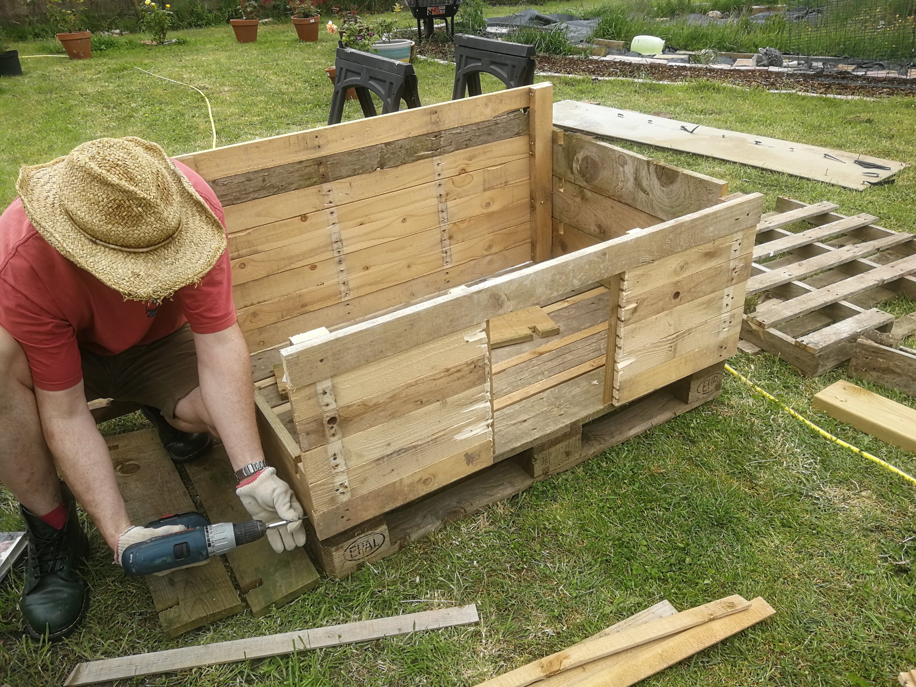 Mr T putting together the Duck house made from used pallets